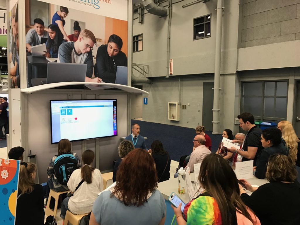 An info session at the Learning.com booth
