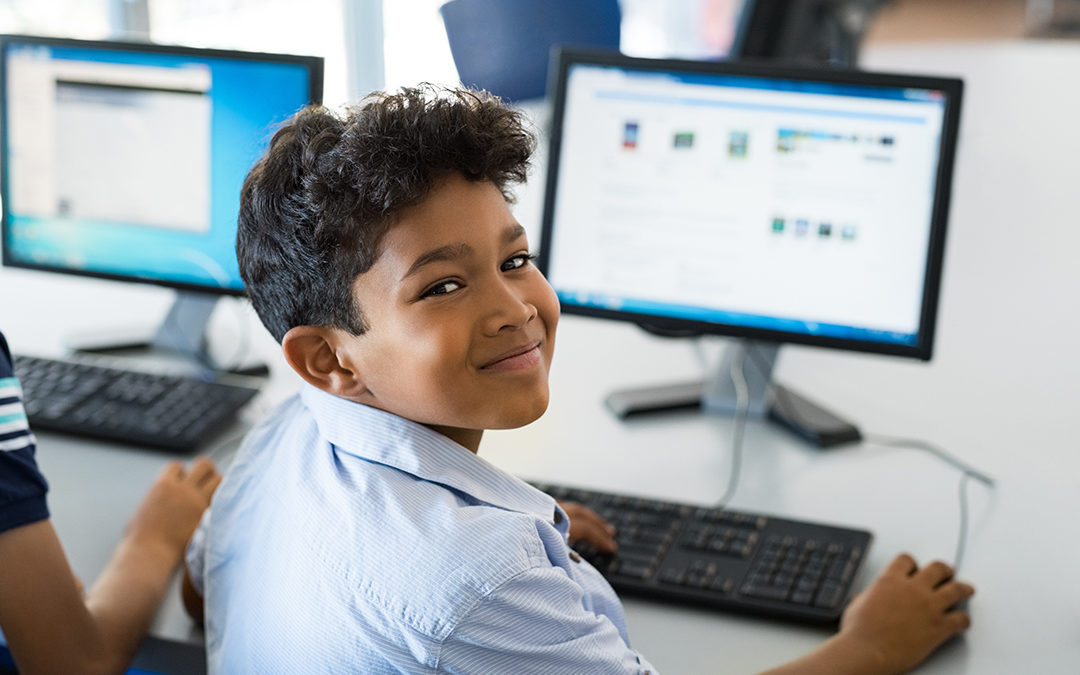 Boy at Computer Exploring Technology Curriculum