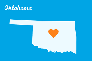 Oklahoma for Web - 300x200 Group of learners around computer smiling