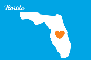 Florida for Web - 300x200 Group of learners around computer smiling