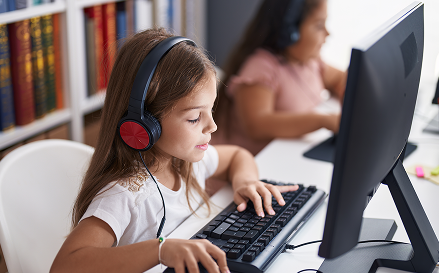 Students on tablet engaging in digital literacy curriculum